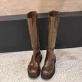 Black chunky heel knight boots with round toe and high shaft, showing the back zip detail.