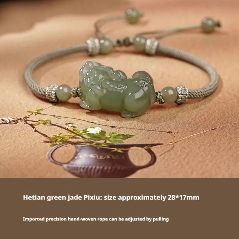 Close-up of a brown and black braided rope bracelet with a central Hetian jade bead on a wrist.