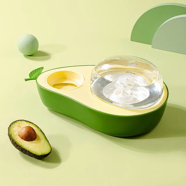 Green avocado-shaped pet feeder with automatic water bottle and separate food bowls