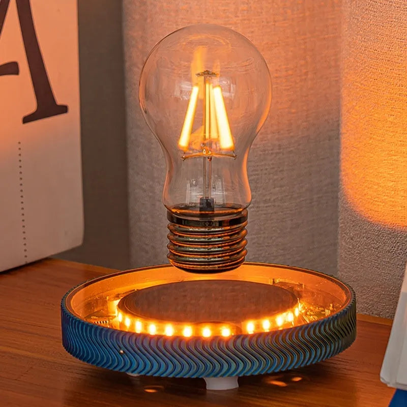 Small magnetic suspension night lamp in a choice of 3D-printed Moon, Saturn, or Bulb shapes on a dark background.