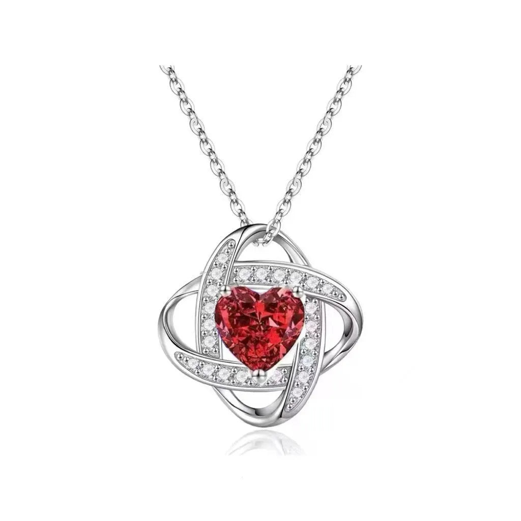 Women's electroplated copper heart-shaped necklace on a model, showing the red diamond colour variant.