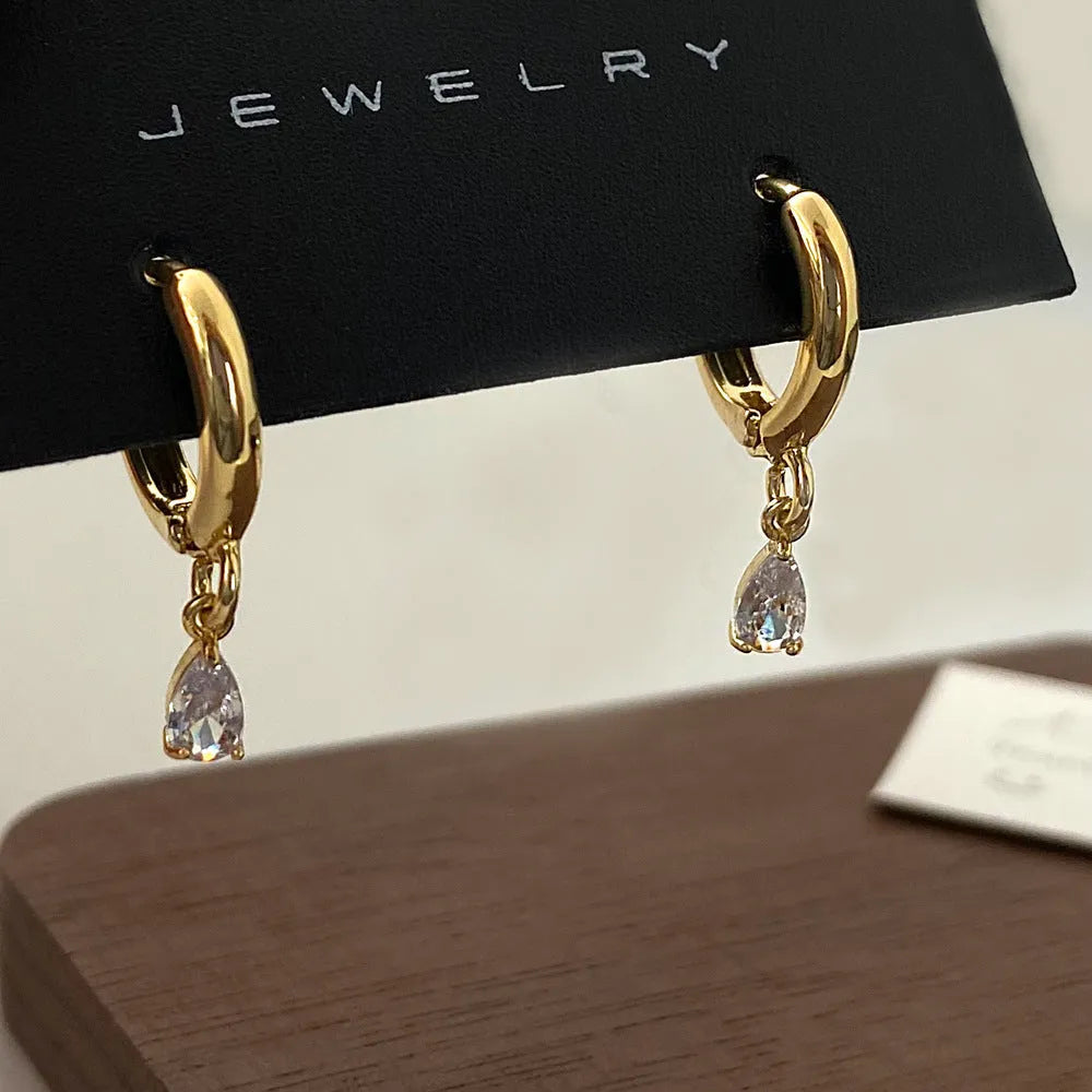 Women's zircon jewellery set showing necklace, earrings, and anklet with geometric meteor shower design.