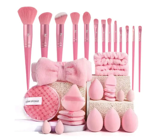 Beauty tool combination set with multiple pieces in brown, pink, and purple colours for face wash and makeup application