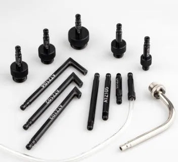 13-piece transmission oil refuelling kit showing injector tool and assorted connectors on a workbench