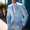 Men's blue solid colour British-style suit jacket with straight hem and white buttons.