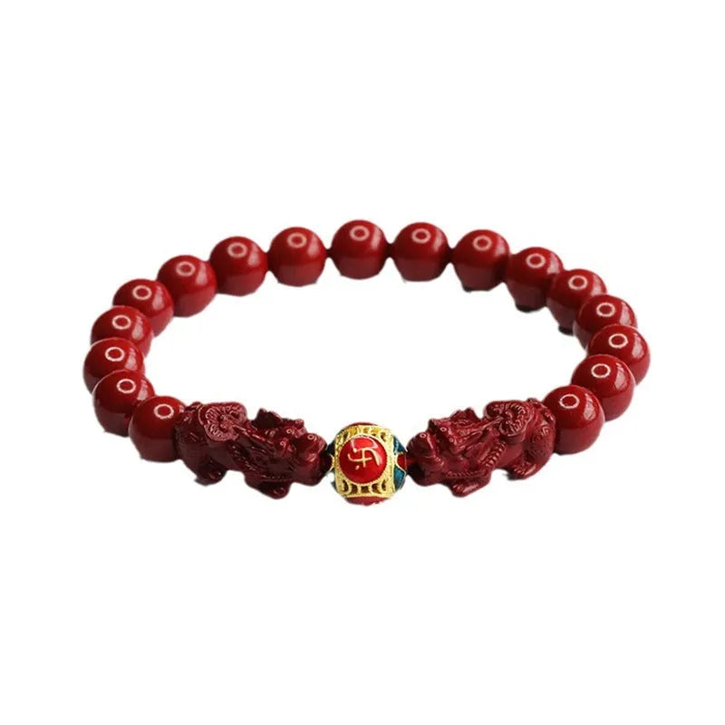Close-up of a purple gold sand carved cinnabar women's bracelet with a double Pixiu design.
