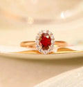 Women's sterling silver ring with gold pigeon red blood gemstone floral inlay