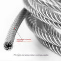 Coiled 304 stainless steel anti-theft security wire rope with a black coated finish on a grey background.