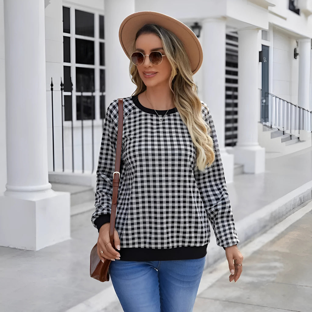 Black long sleeve pullover sweater with a classic plaid stripe print pattern.