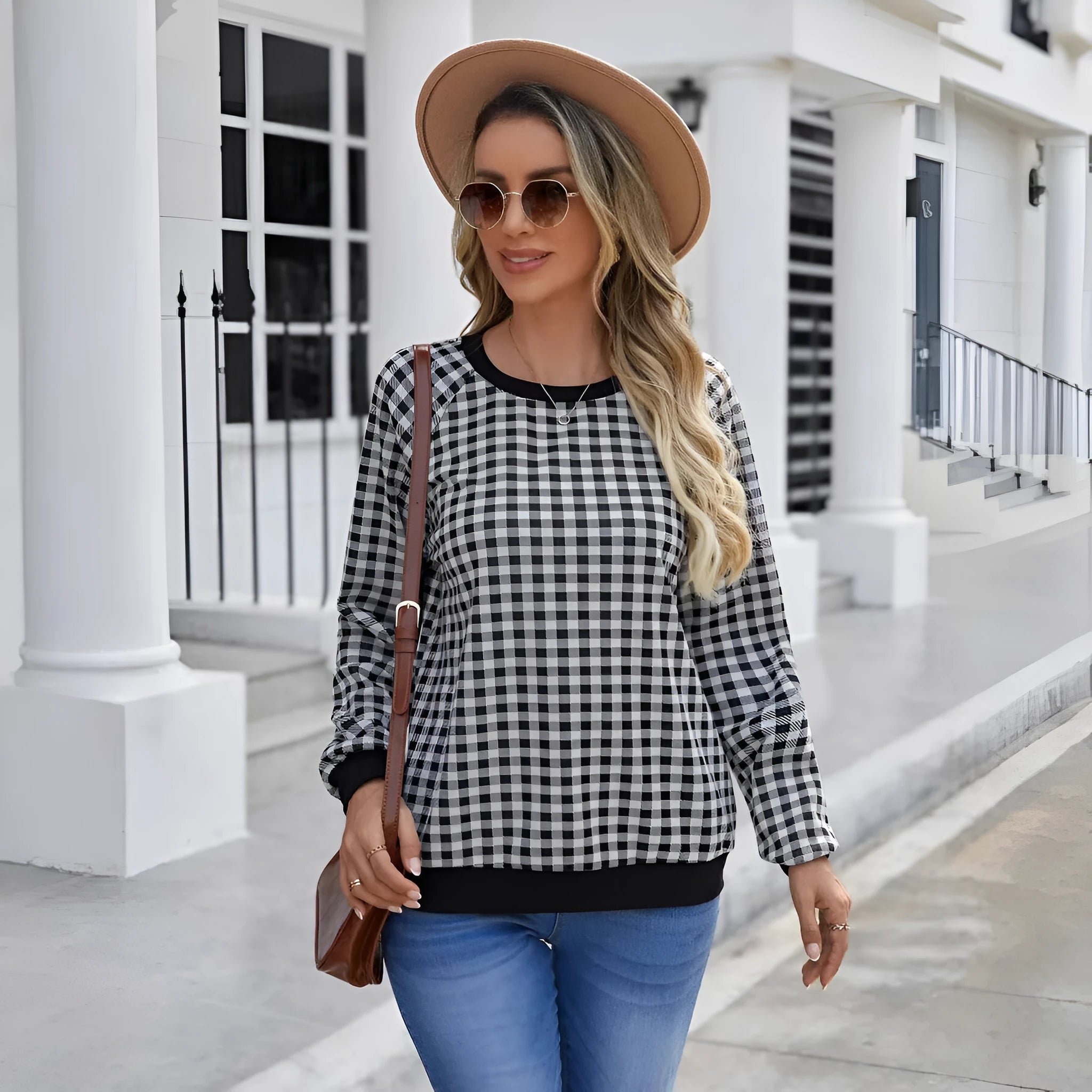 Black long sleeve pullover sweater with a classic plaid stripe print pattern.