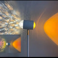 Modern sunset red floor lamp projecting a water wave light pattern on a wall, with four colour cards shown alongside.