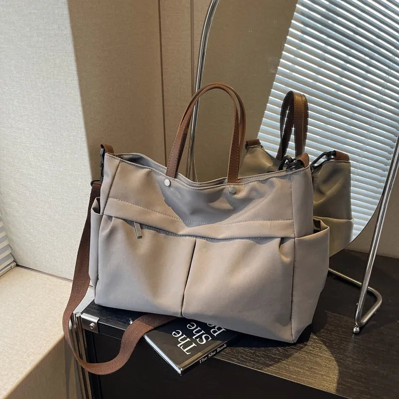 Women's nylon crossbody tote shoulder bag in black colour with measurements 39x14x28cm