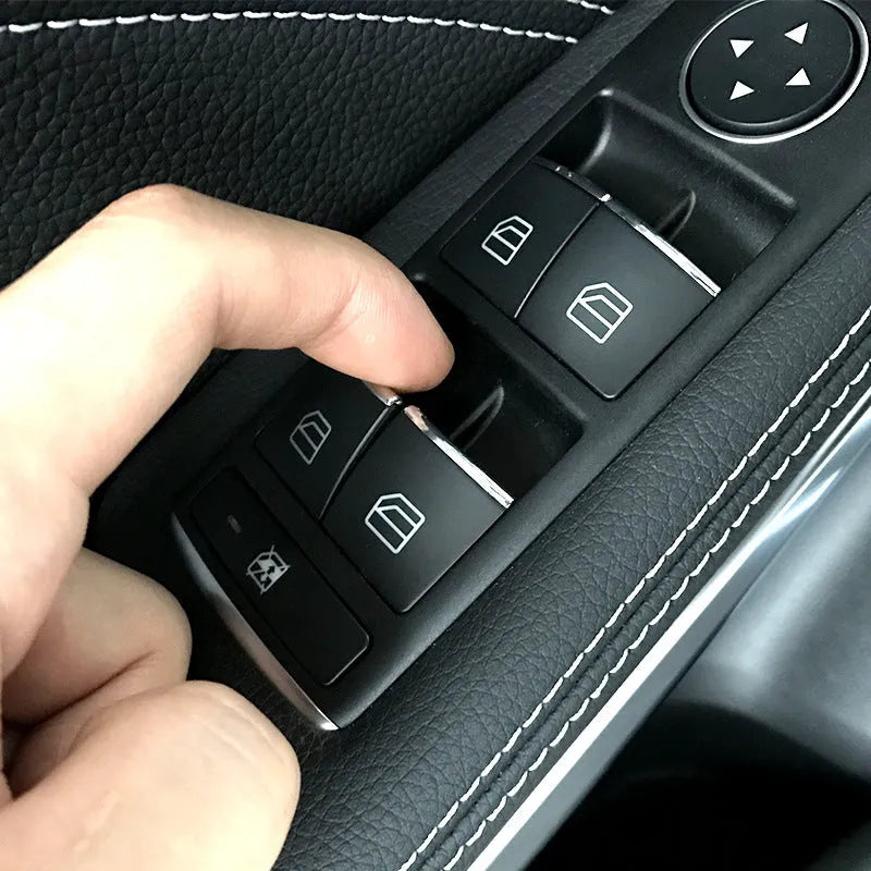 Black ABS plastic decorative sticker for a car window lift button.