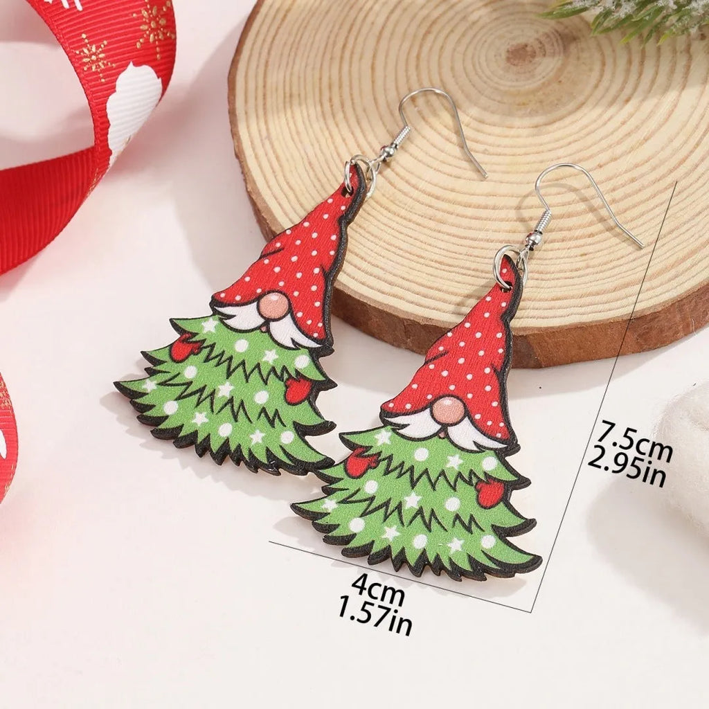 Women's wooden Christmas earrings with printed tree and snowman designs in geometric shapes