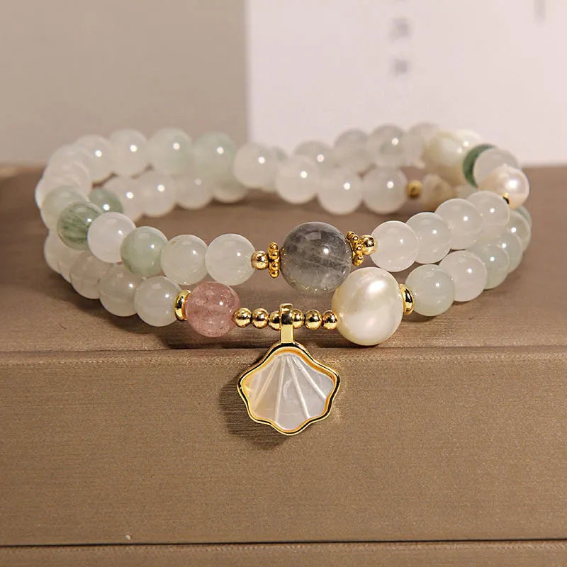 Women's Tianshan emerald green crystal bracelet with gold-plated apricot leaf pendant and rhinestones.