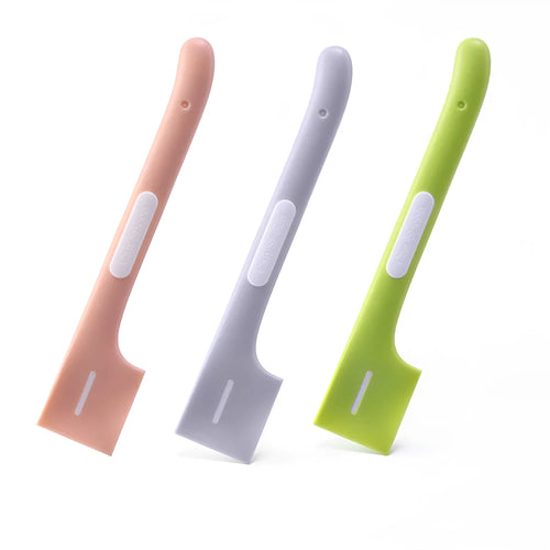 Green long-handled TPR spoon for scooping wet pet food from a tin.