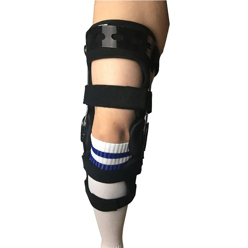 Black hinged knee pad and supporter for anterior ligament, shown with iron and plastic side hinges.