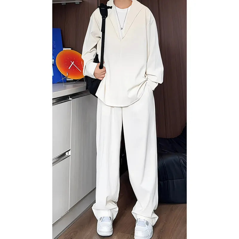 Men's black casual two-piece set with long sleeve polo shirt and trousers on a hanger