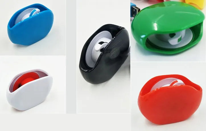 Automatic plastic cable winder retractor showing black, blue, and red units next to a coiled earphone cable.