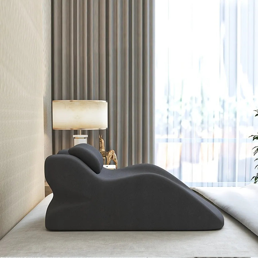 Stomach sleeper pillow designed for reading and phone use while lying down in blue colour option