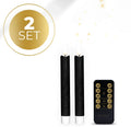 Set of four black plastic LED taper candles with realistic orange flickering flame effect