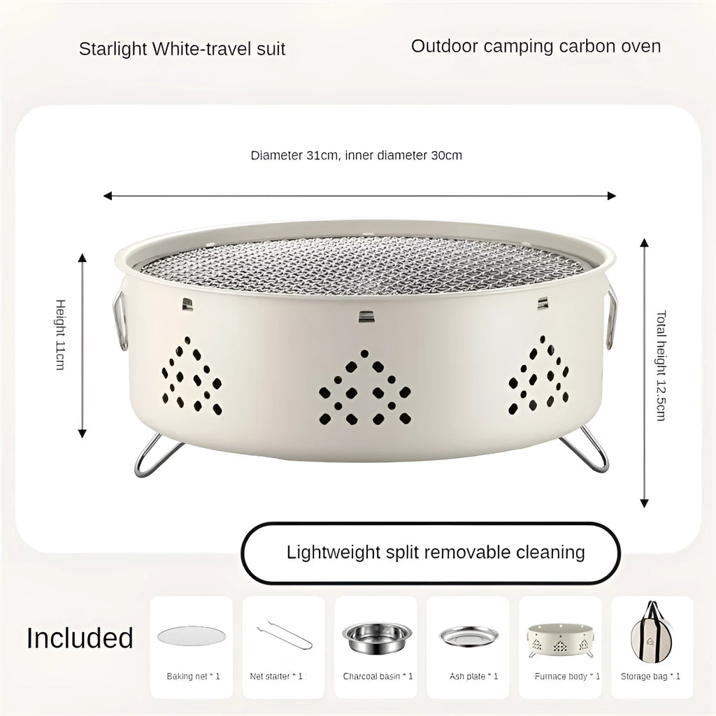 Portable stainless steel barbecue grill with detachable parts on a grassy outdoor surface.