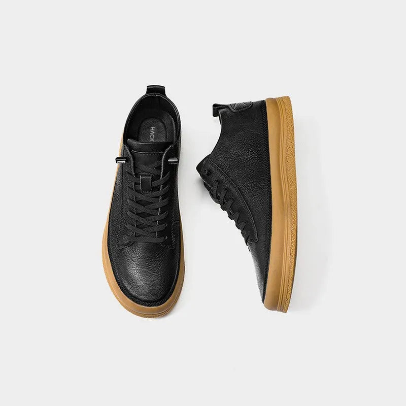 Men's black casual leather shoes with round toe and lace-up front on a white background.