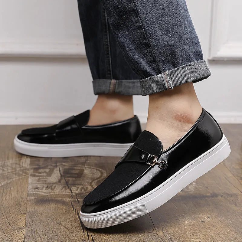 Men's black faux leather slip-on loafers featuring a gold horsebit buckle and a round toe.