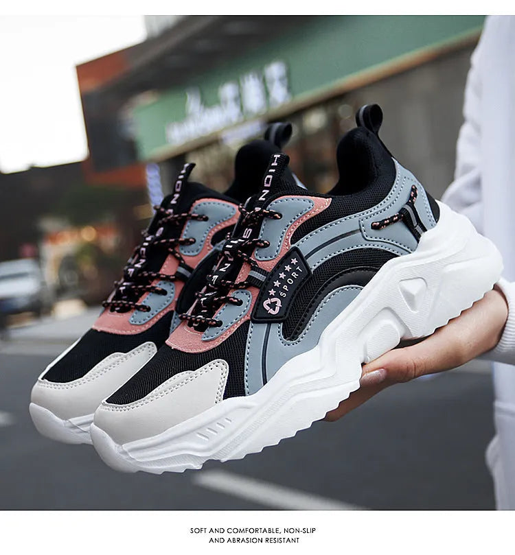White women's casual sport shoes with a mesh upper, thick PU sole, buckle detail, and round toe.