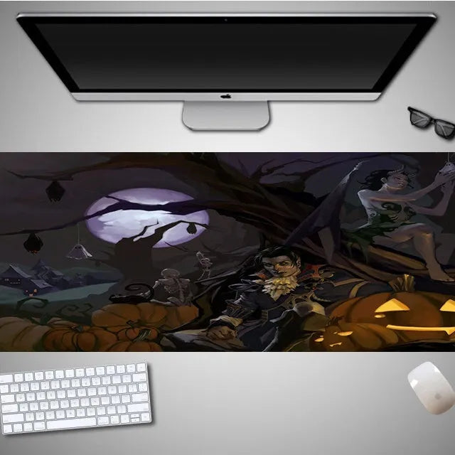 Large Halloween patterned gaming mouse pad on a desk showing non-slip rubber base and extra-long design.