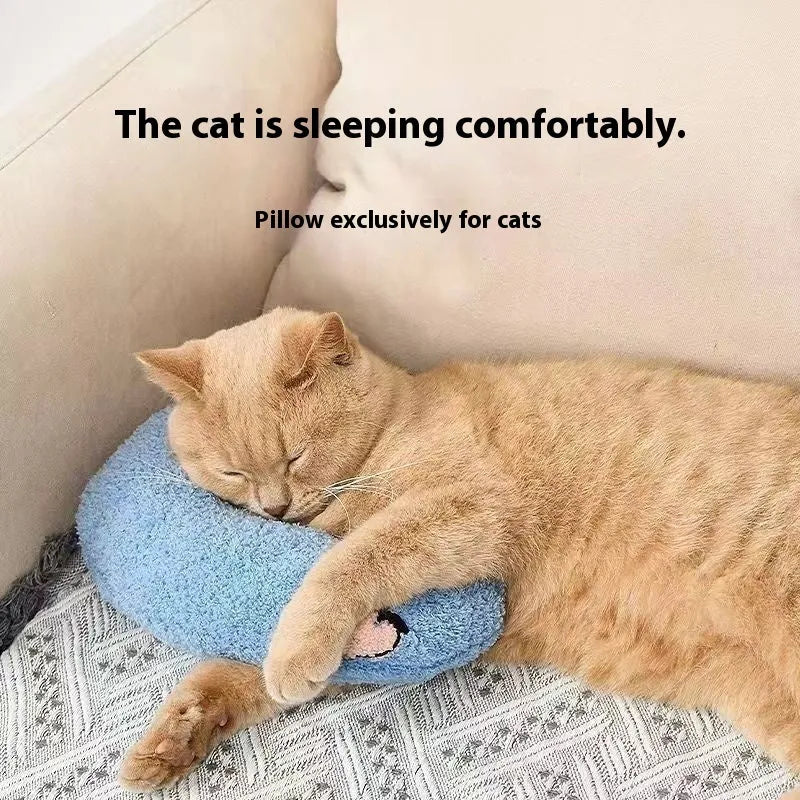 Blue and yellow question mark shaped cat bed with a U-shaped pillow for neck support on a wooden floor.