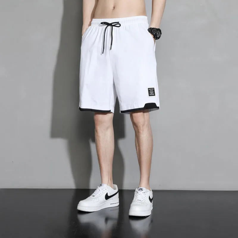 Boys' cotton shorts in black, khaki, or white, showing mid-waist and shorts length design.