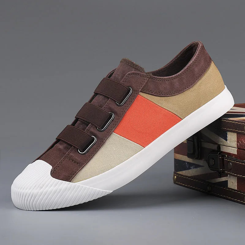 Men's canvas sneakers with rubber sole in multiple colour options showing low top design and elastic band