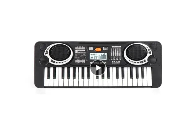 Children's 37-key electronic organ toy in black plastic on a table