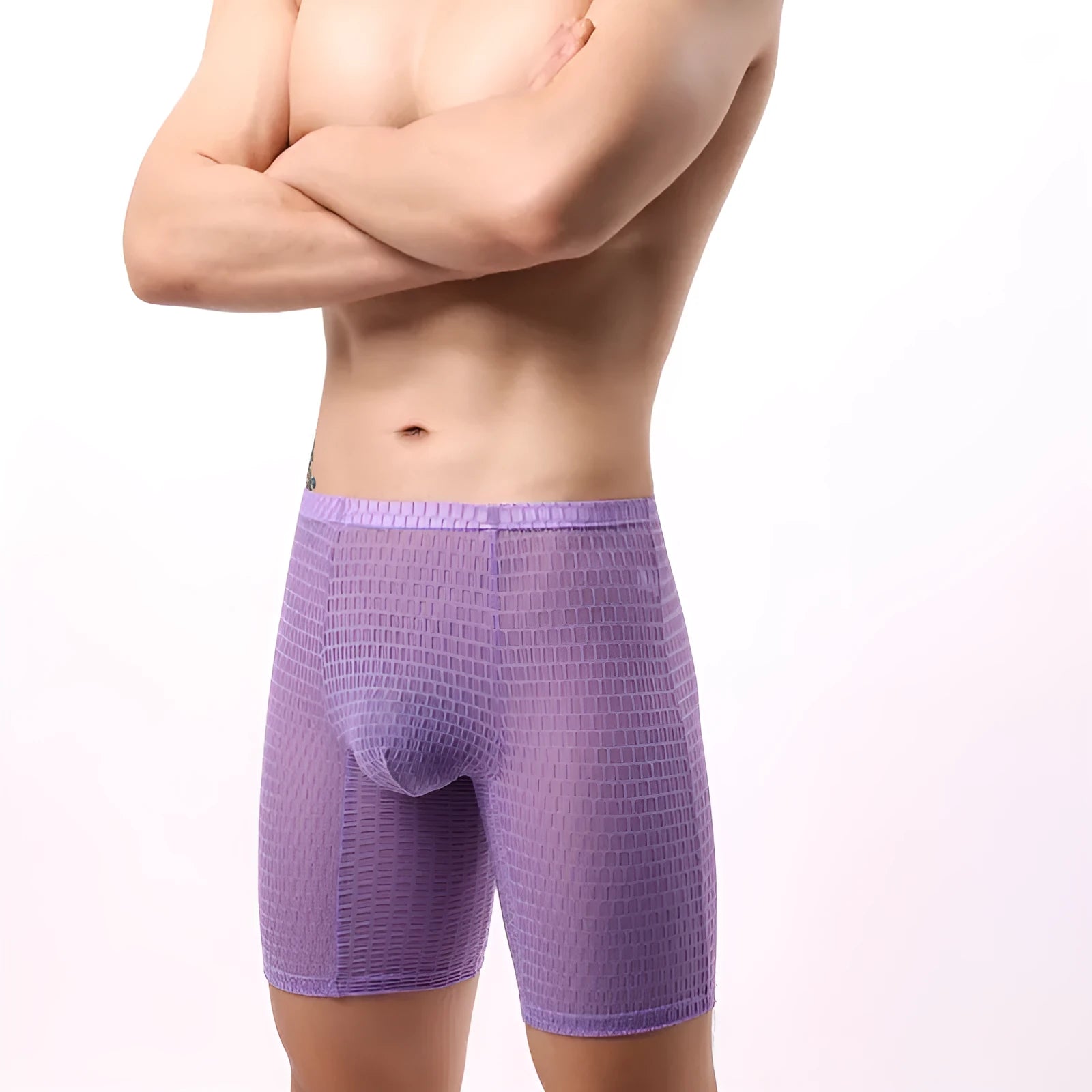 Men's white lace boxer shorts with a lengthened leg and mid-waist design on a plain background.