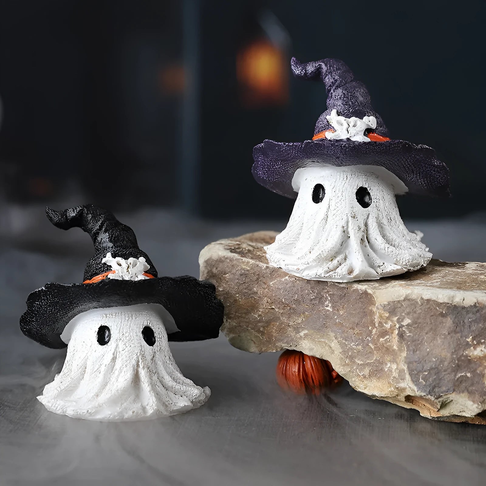 Black and purple resin wizard hat holiday ornament on a festive background.