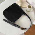 Women's soft PU shoulder bag with swing threads decoration showing black and brown colour options