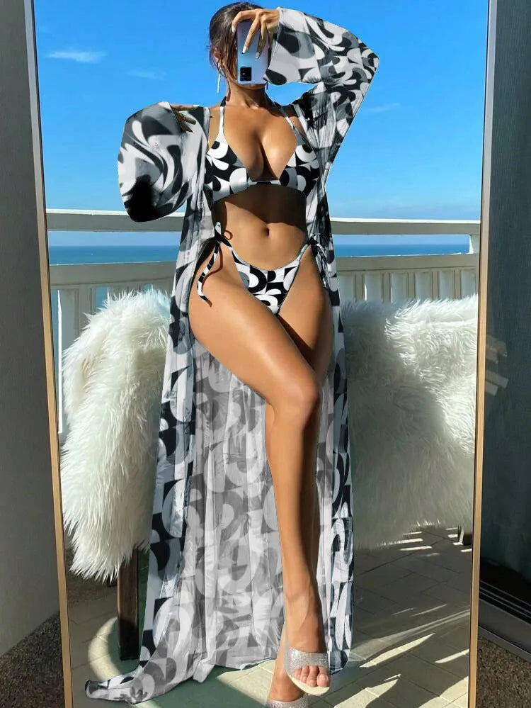 Split long sleeve ins blouse and banded bikini swim set with matching outer robe in multiple colours.