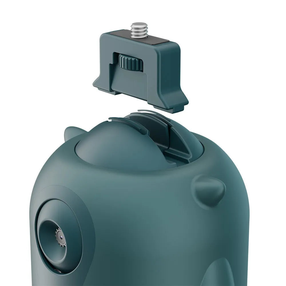 Dark green intelligent AI face tracking gimbal with 360-degree rotation on a table.