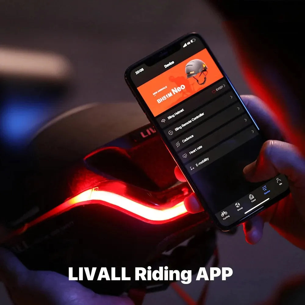 Matte black smart bicycle helmet with integrated LED lights on front and sides for night riding safety.