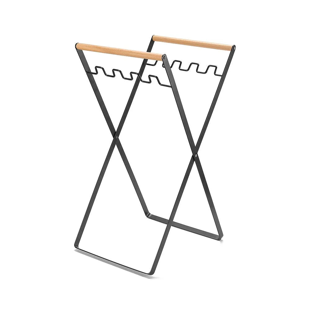 Outdoor iron folding trash rack with wooden handle holding rubbish sack