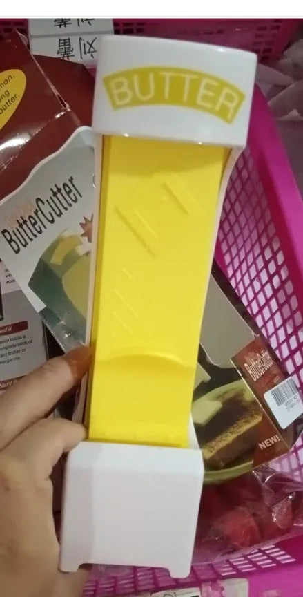 Yellow ABS plastic butter cutter with one-button dispenser and stainless steel blade for 4.75-inch bars
