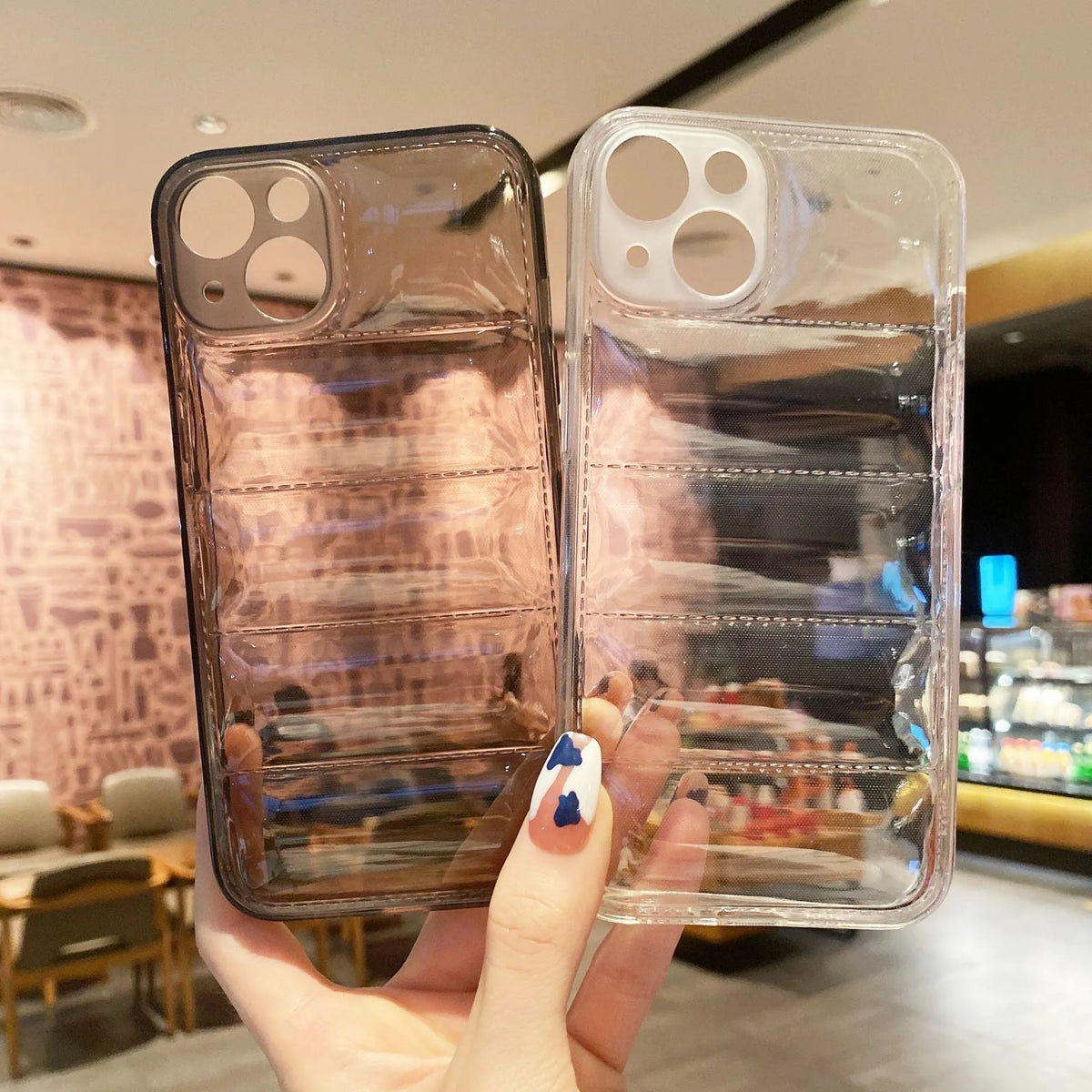 Transparent TPU air cushion phone case for iPhone 15 series with down jacket design, shown in transparent and transparent black.