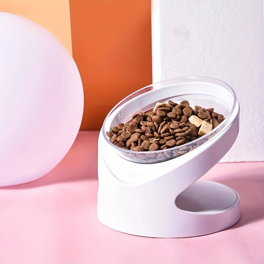 White clear plastic elevated cat food bowl with anti-vomit tilt design on stable base