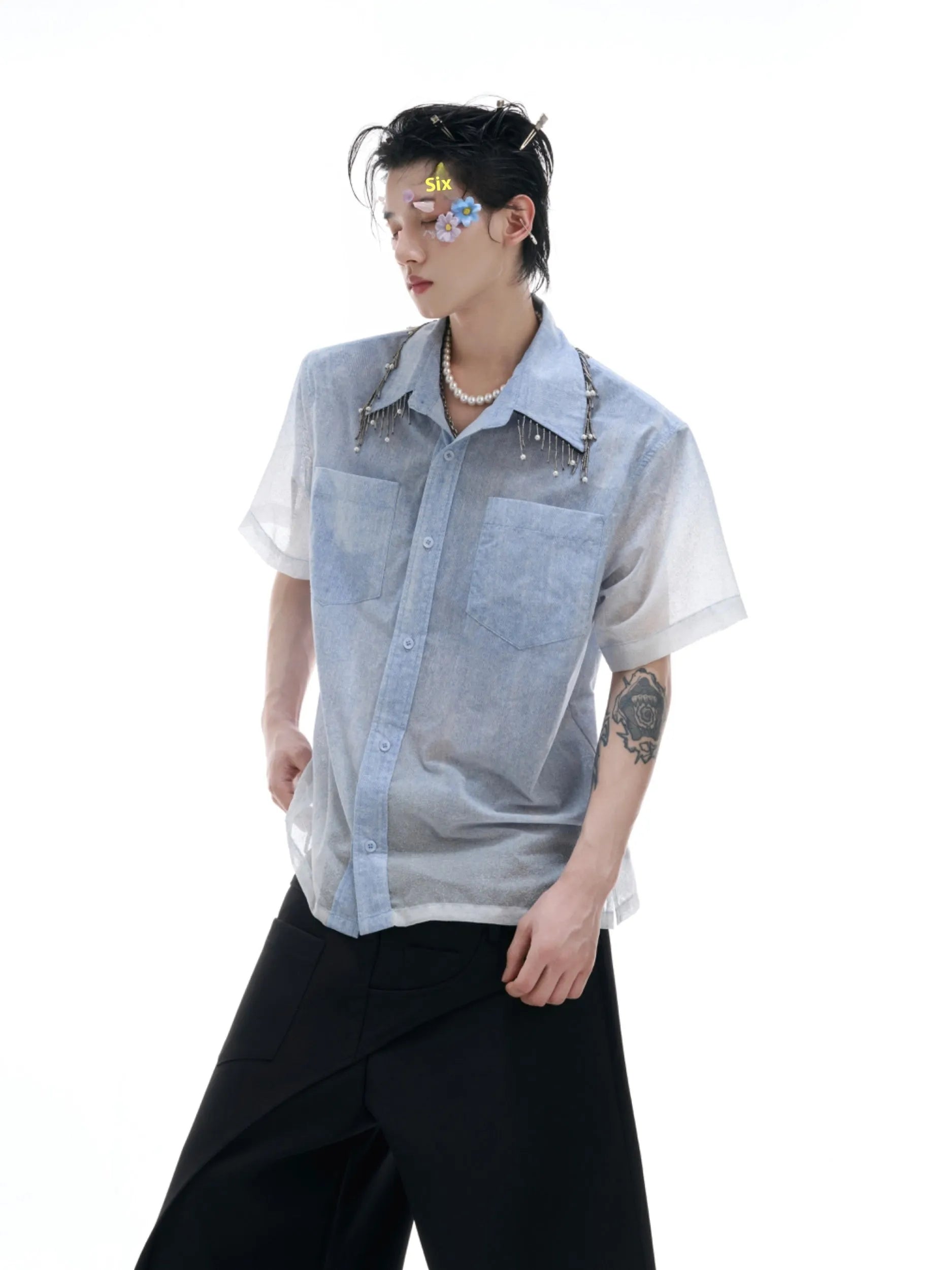 Blue and white gradient short-sleeved casual shirt on a hanger.