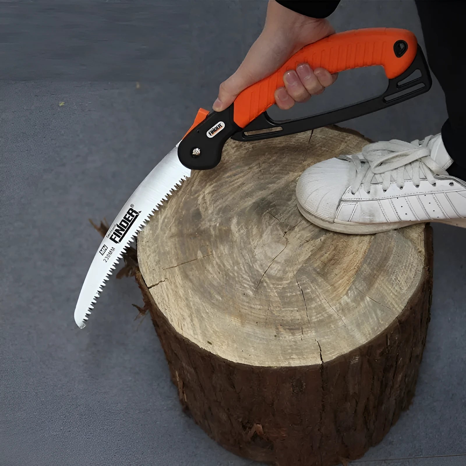 Orange handled folding garden saw with a 9 inch steel blade shown both open and closed.