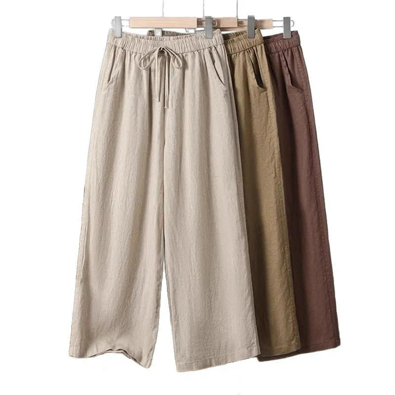 Women's straight-leg casual trousers in apricot colour with a drawstring elastic waistband and lace-up detail.