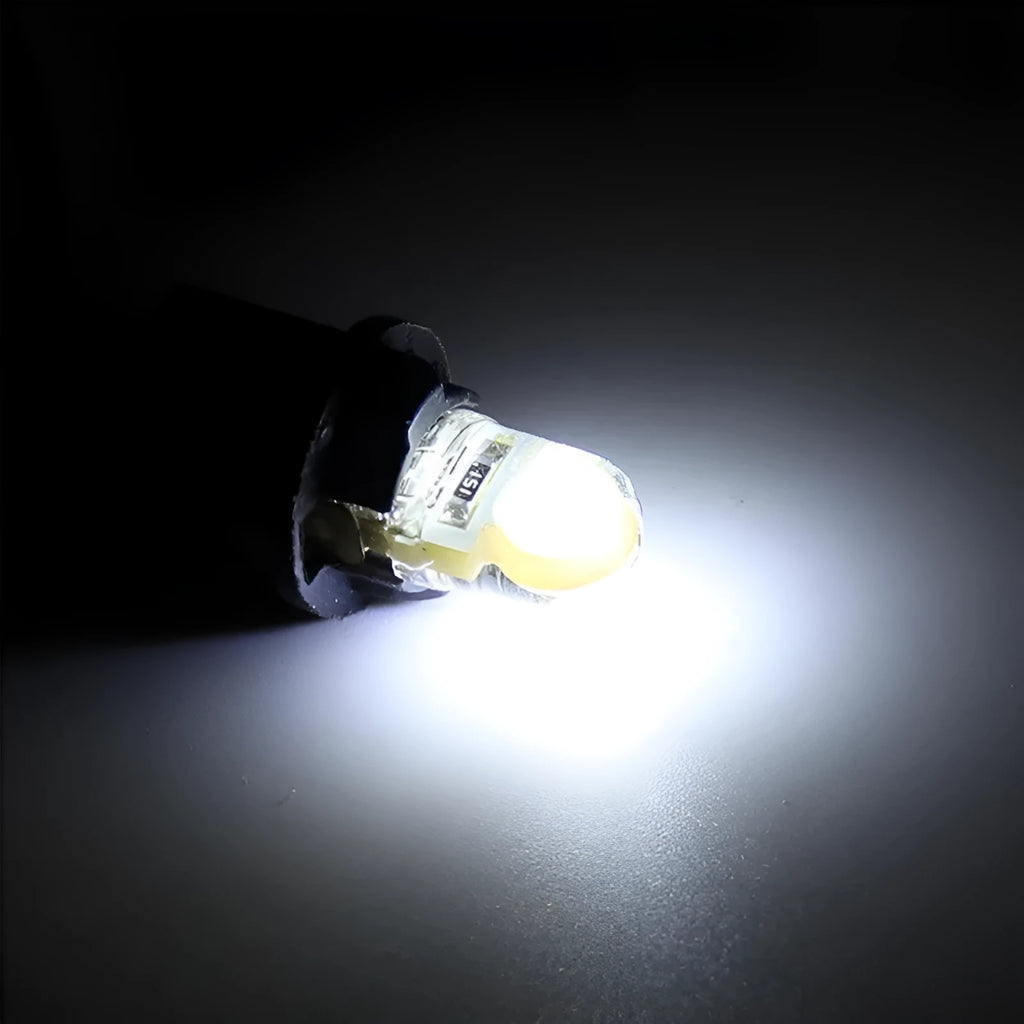 Ten T10 wedge base LED bulbs with silicone housing in a pack, showing multiple colour options