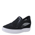 Women's wedge slip-on shoes with mesh upper in black colour showing rubber sole