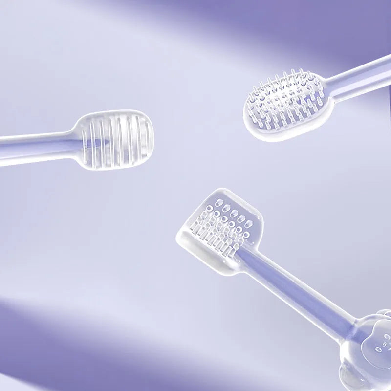 Blue, green, and purple pet toothbrushes with soft silicone bristle heads for dogs and cats.